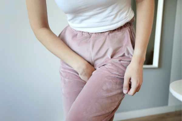 woman running for the toilet because of urinary incontinence Eastbourne